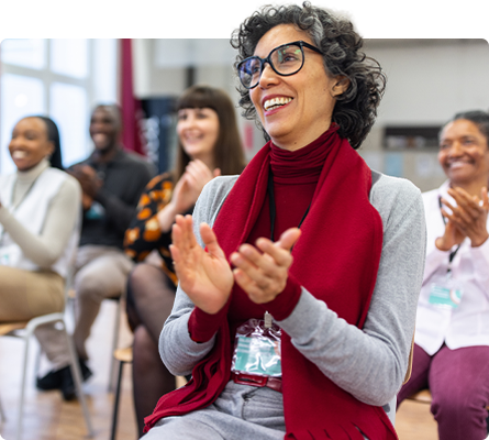 woman clapping hands during event