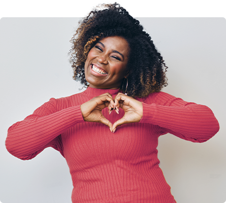 woman holding heart hands